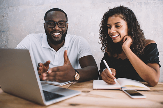 diverse-workforce Employee working on a project with a mentor.